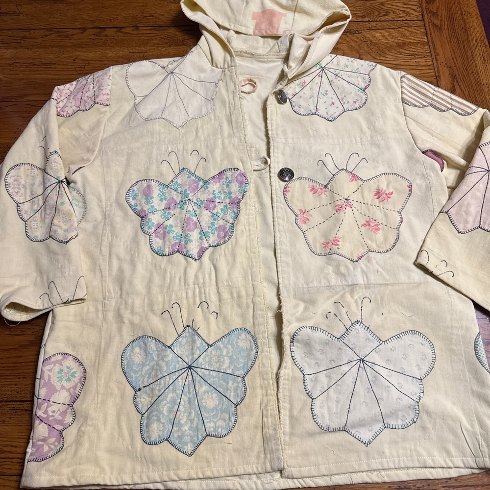 Antique quilt up cycled to jacket. It's like an XL.